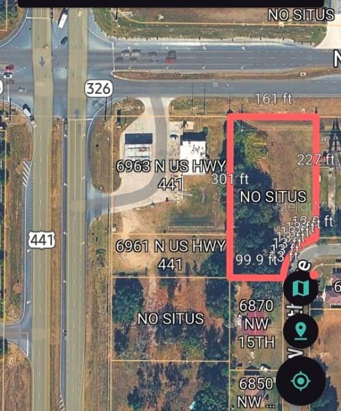 This is a satellite map view showing a highlighted parcel of land near a highway — HWY 326 / NW 70TH, OCALA, FL