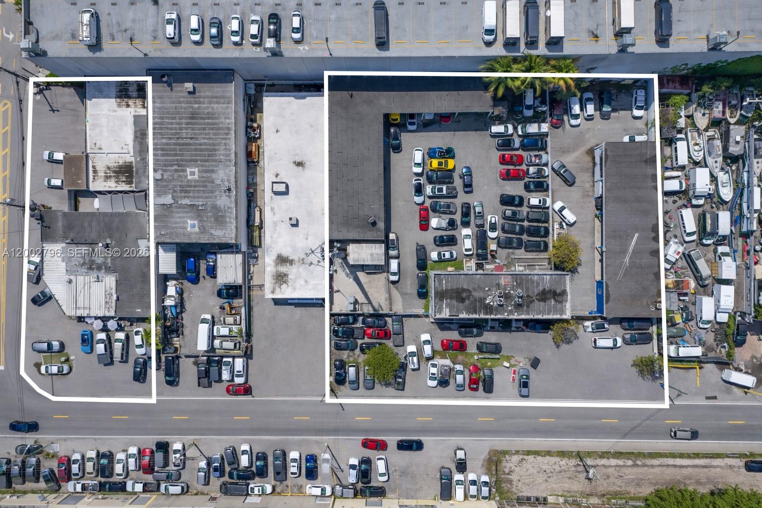 This aerial view shows two commercial properties with parking lots and surrounding industrial buildings — 3300 & 3326 NW South River Dr, Miami FL 33142, MIAMI, FL