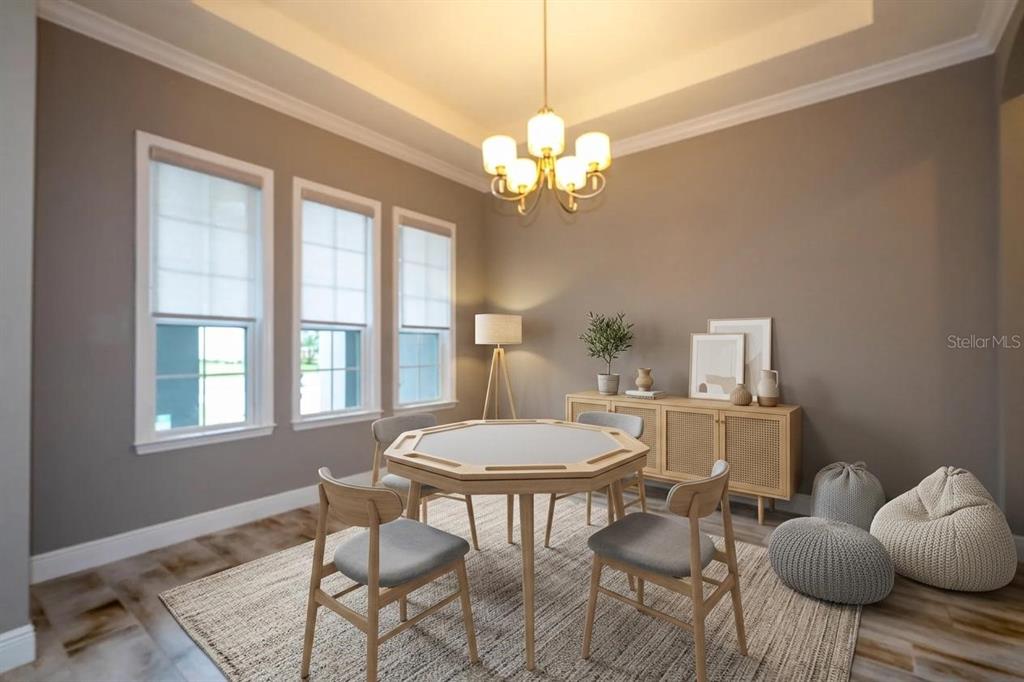This dining room features an octagonal table, four chairs, a sideboard, and a chandelier — 7573 GREEN MOUNTAIN WAY, WINTER GARDEN, FL