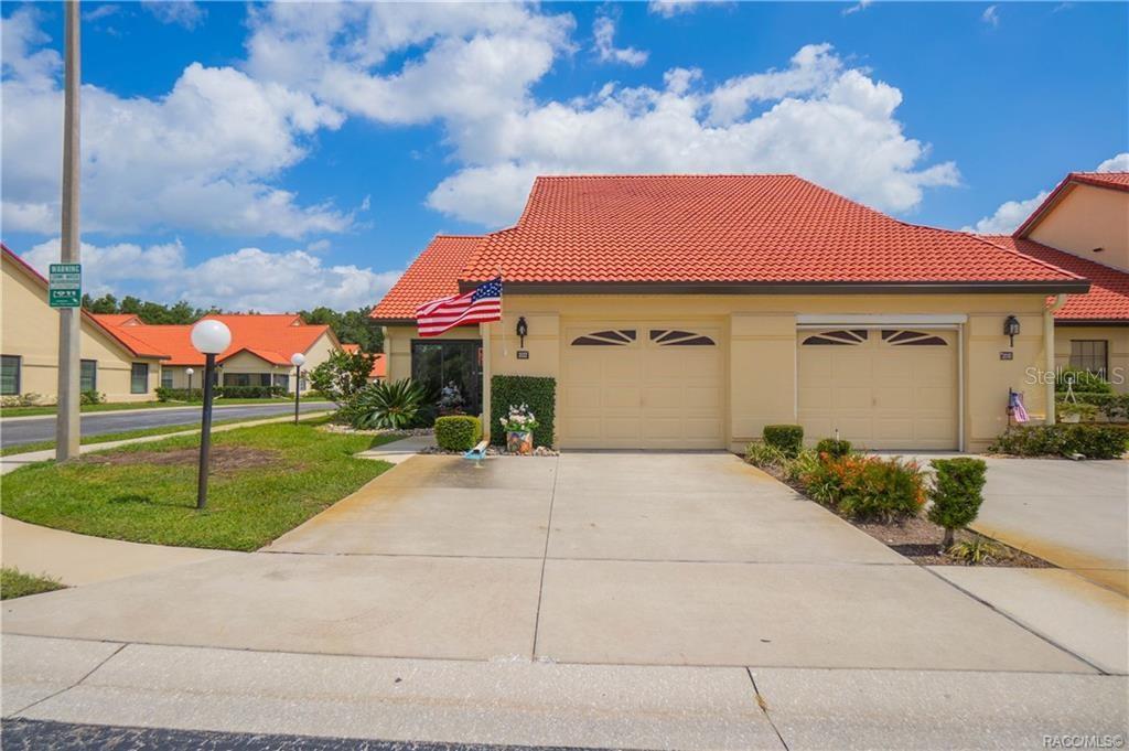 A yellow one-story house with a red tile roof and a two-car garage — 2022 FOREST DRIVE, INVERNESS, FL