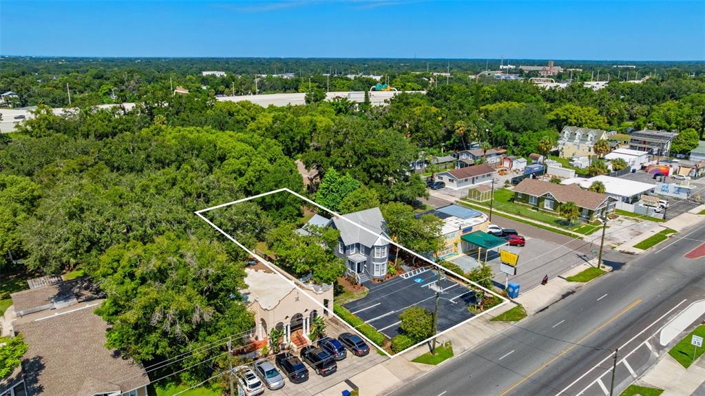 An aerial view shows a commercial property with a parking lot and two buildings — 4206 NEBRASKA AVENUE N, TAMPA, FL