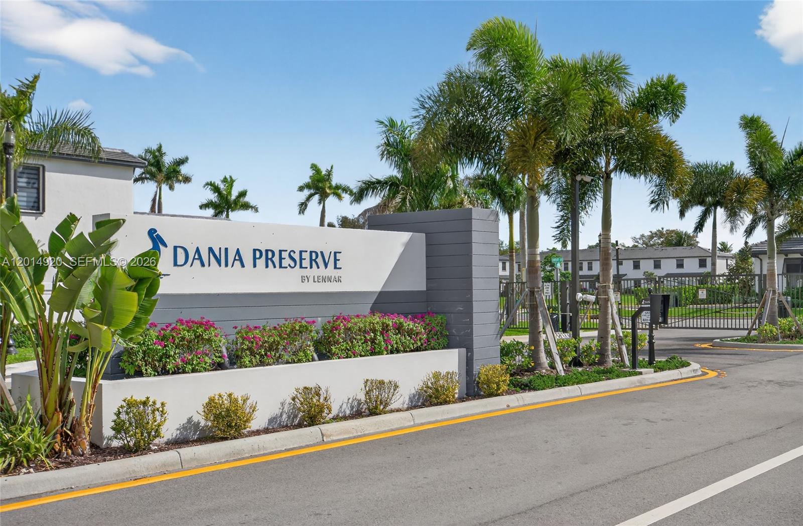 A sign for Dania Preserve by Lennar stands near a gated entrance with palm trees — 4981 Peacock Way, Dania Beach FL 33312, DANIA BEACH, FL
