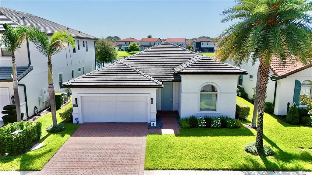 An empty room with light-colored tile flooring, white walls, recessed lighting, and pink window curtains — 10481 ROYAL CYPRESS WAY, ORLANDO, FL