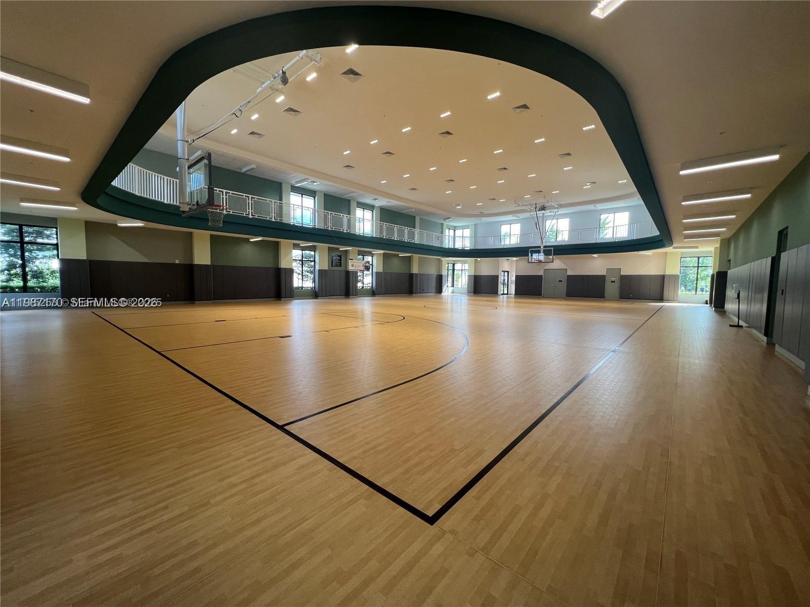 An indoor basketball court features light wood flooring, a mezzanine level, and recessed lighting — 8167 NW 41st St # 308, Doral FL 33166, DORAL, FL