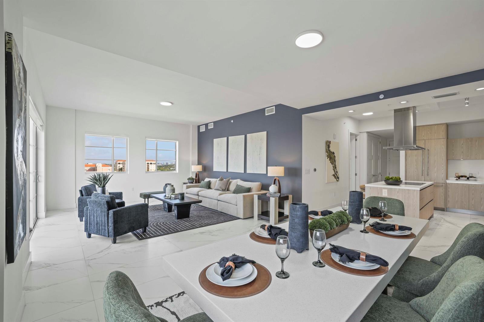 An open-concept living and dining area features white marble floors and a blue accent wall — 155 E Boca Raton Road # 823, Boca Raton FL 33432, BOCA RATON, FL