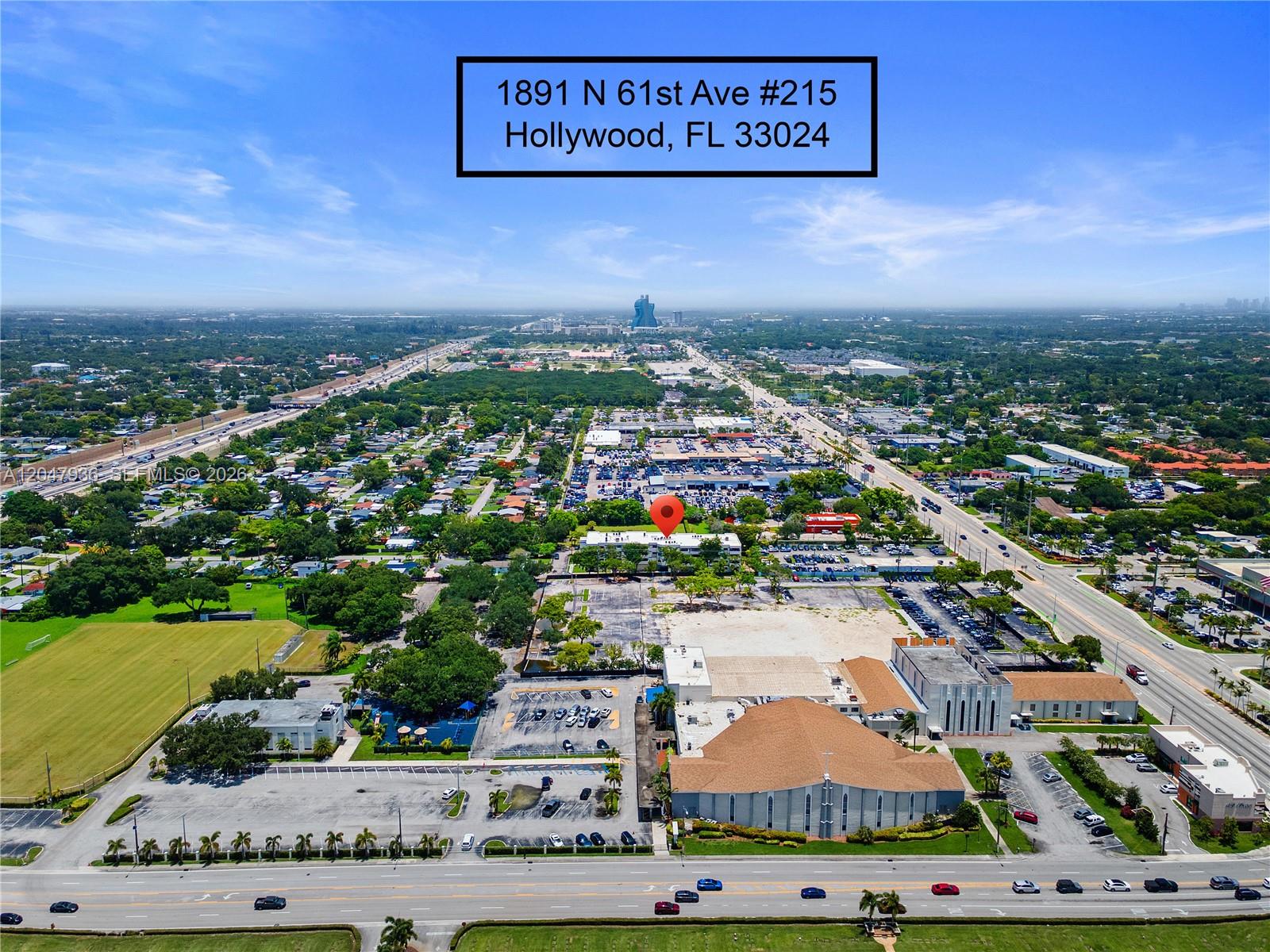 This is an aerial view of a residential building marked with a red pin — 1891 N 61st Ave # B215, Hollywood FL 33024, HOLLYWOOD, FL