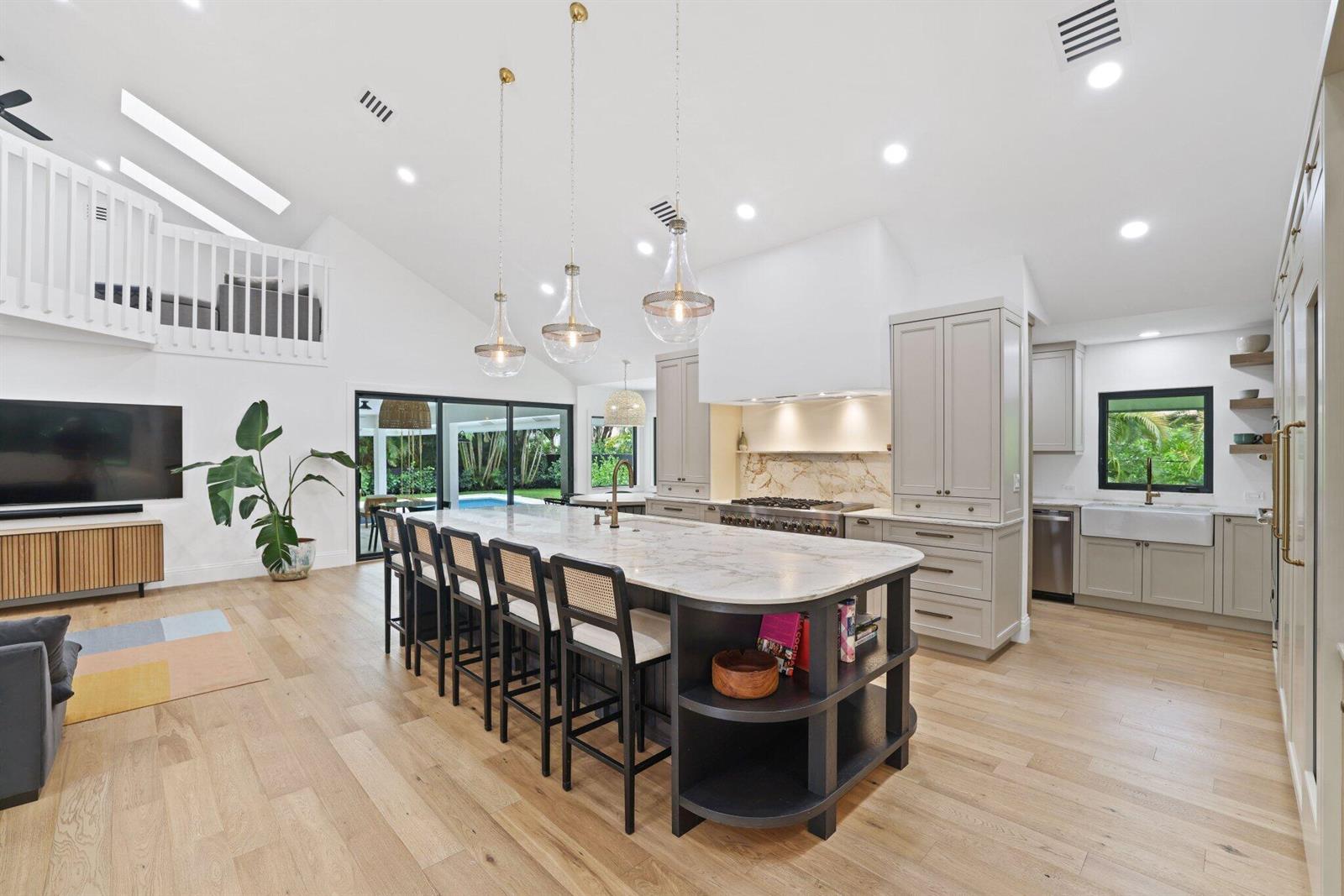A white house with a dark metal roof and a paved walkway leading to the entrance — 3235 Hyde Circle, Boca Raton FL 33434, BOCA RATON, FL