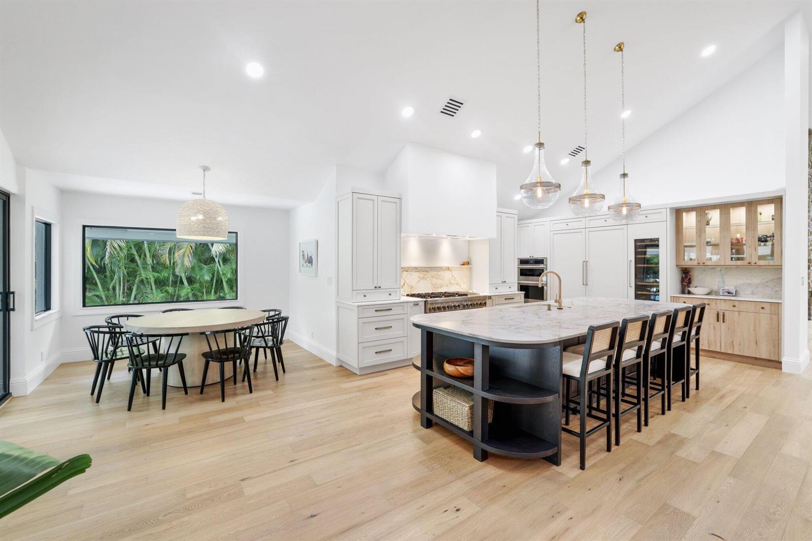 A brick walkway leads to the black double front doors of a white stucco house — 3235 Hyde Circle, Boca Raton FL 33434, BOCA RATON, FL