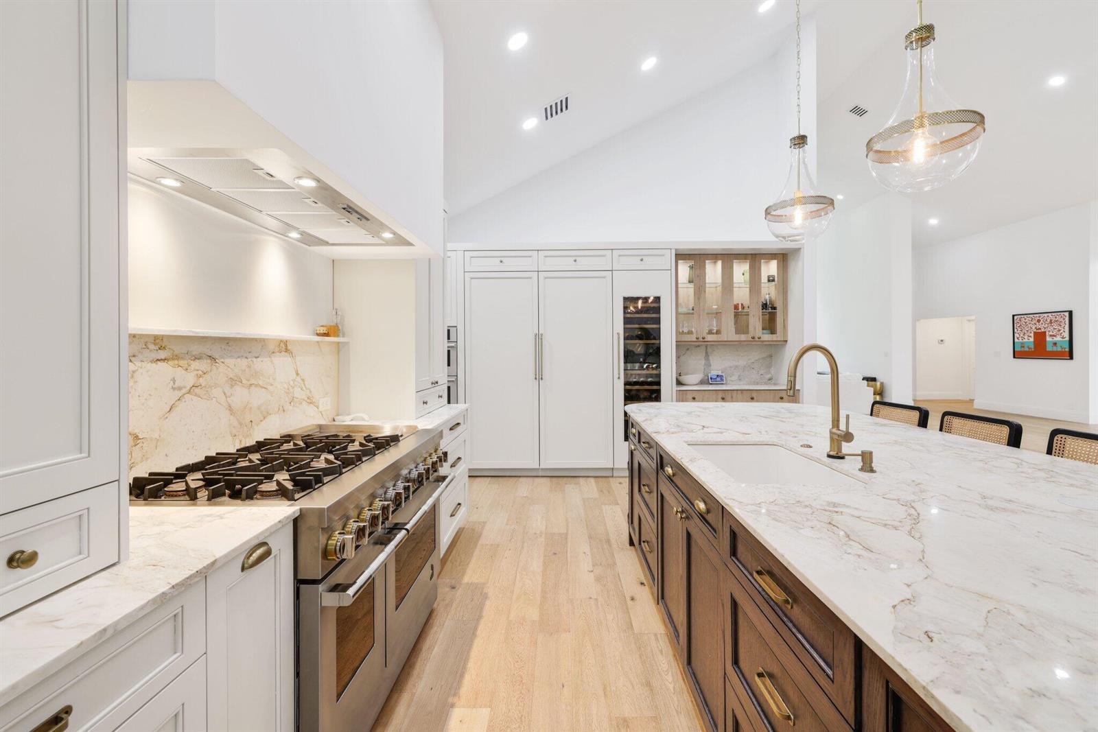 An open front door reveals a bright interior with hardwood floors and a dining area — 3235 Hyde Circle, Boca Raton FL 33434, BOCA RATON, FL