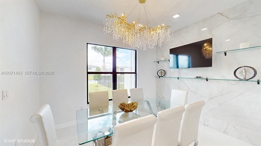 A dining room features a glass table, white chairs, a crystal chandelier, and marble walls — 8350 Royal County Down Rd, Boca Raton FL 33434, BOCA RATON, FL