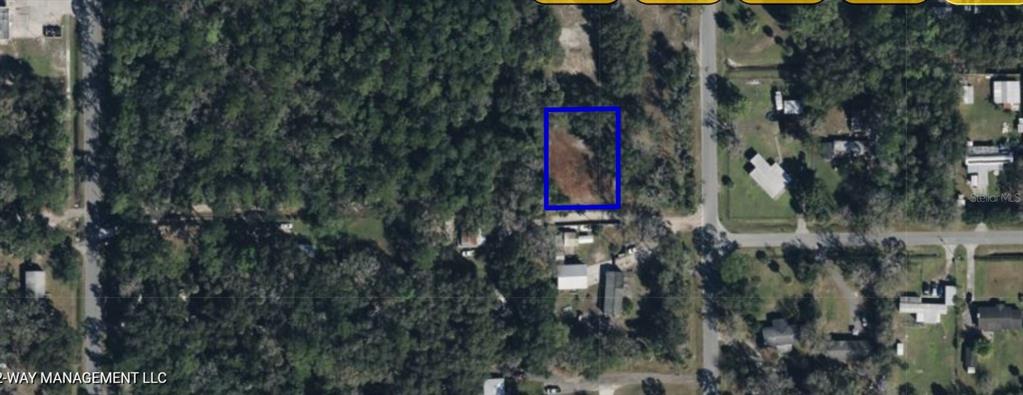 This is an aerial map showing a vacant, rectangular lot outlined in blue — 792 ST CATHERINE AVENUE, CHRISTMAS, FL