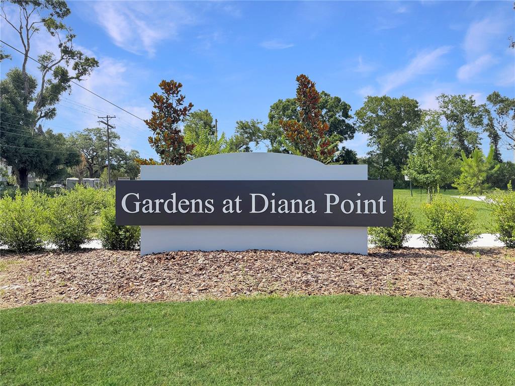 A sign for Gardens at Diana Point stands in a landscaped area with trees — 4345 CAMBIO GARDENS COURT, TAMPA, FL