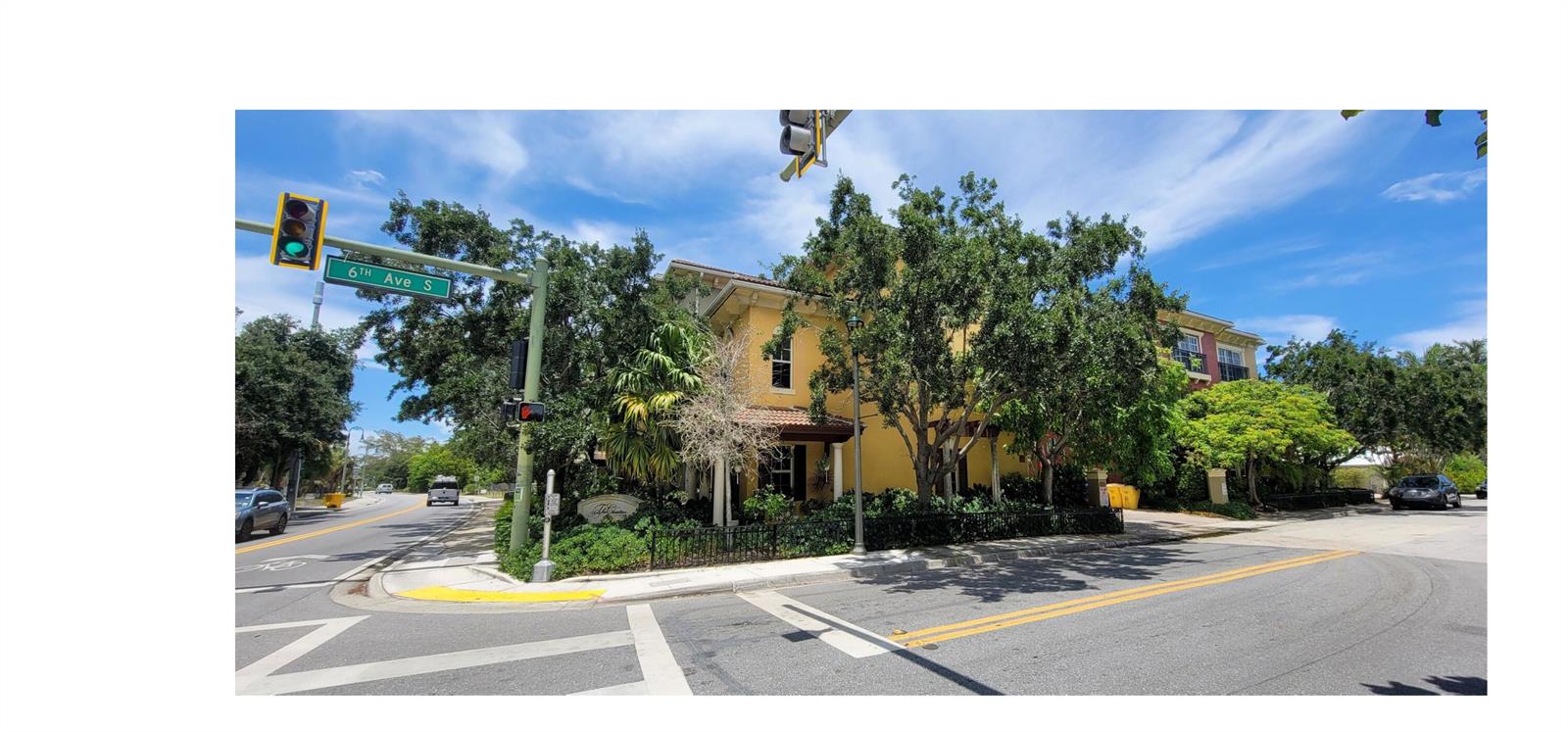 A yellow multi-story building stands on a corner lot at an intersection with traffic lights — 530 S Federal Highway # 8, FL 33460, FL