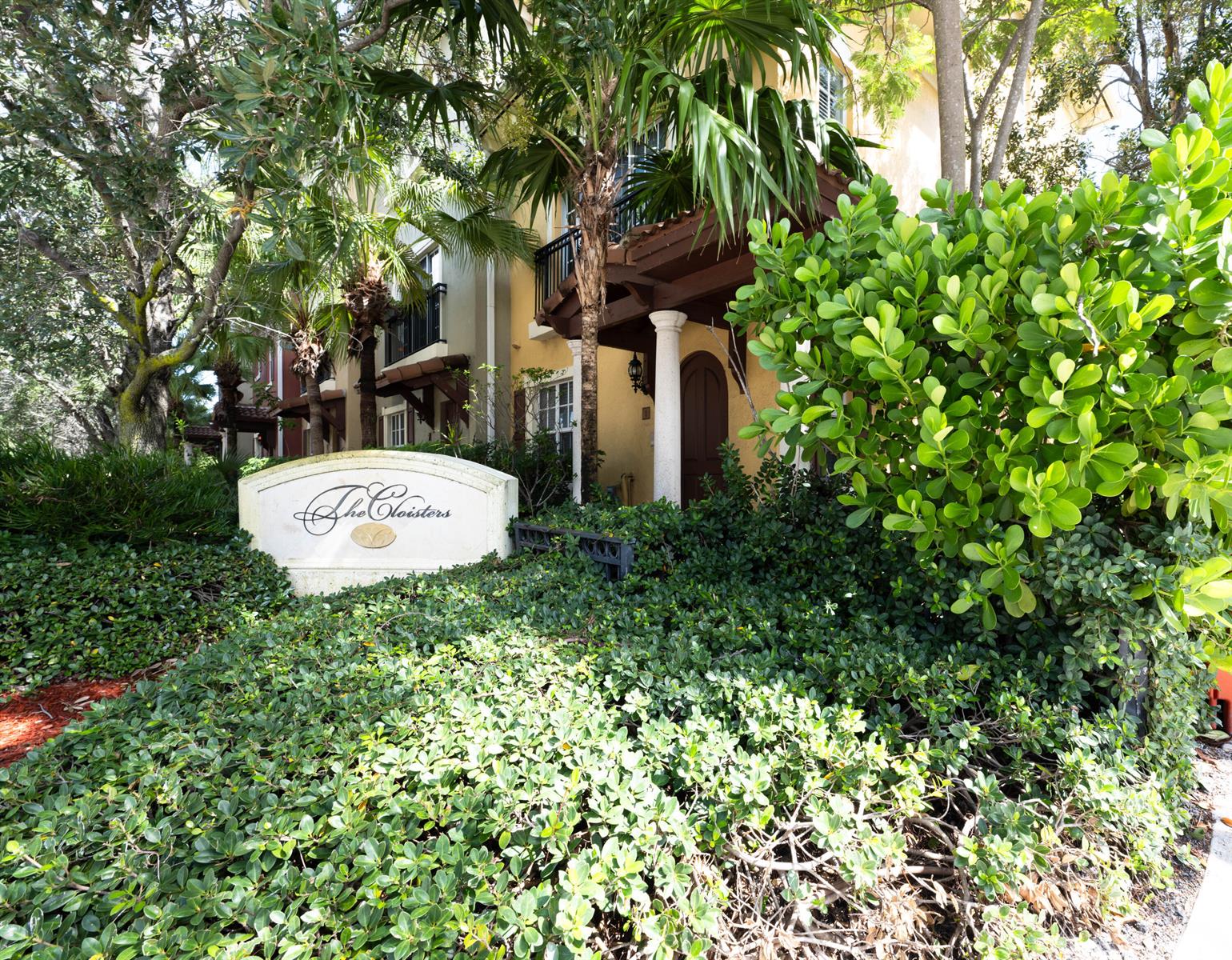 A sign for The Cloisters stands in front of a multi-story building with lush landscaping — 530 S Federal Highway # 8, FL 33460, FL