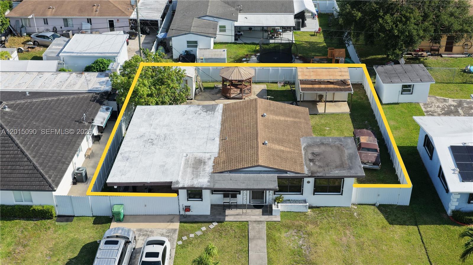 An aerial view shows a single-story house with a fenced backyard, gazebo, and shed — 10955 SW 217th Ter, Miami FL 33170, MIAMI, FL