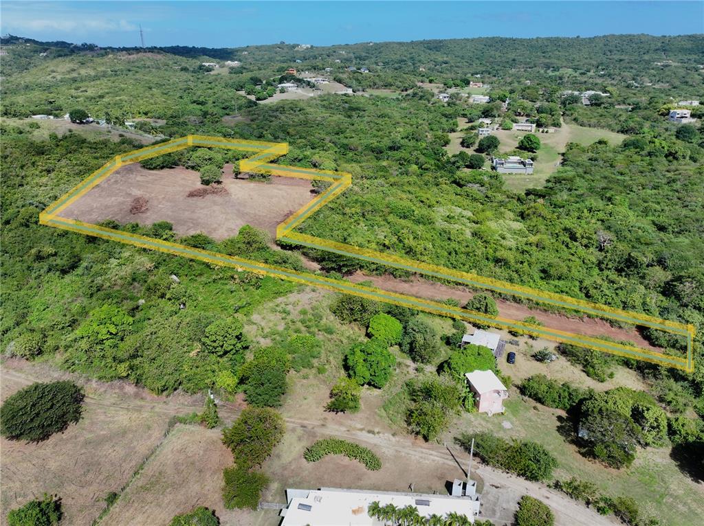 An aerial view shows a large, cleared plot of land outlined in yellow — A-1 FINCA VIEQUES, VIEQUES, PR