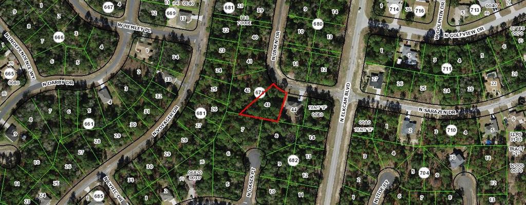 This is a satellite map view showing a highlighted residential lot in a wooded neighborhood — 7792 N IBSEN DRIVE, DUNNELLON, FL