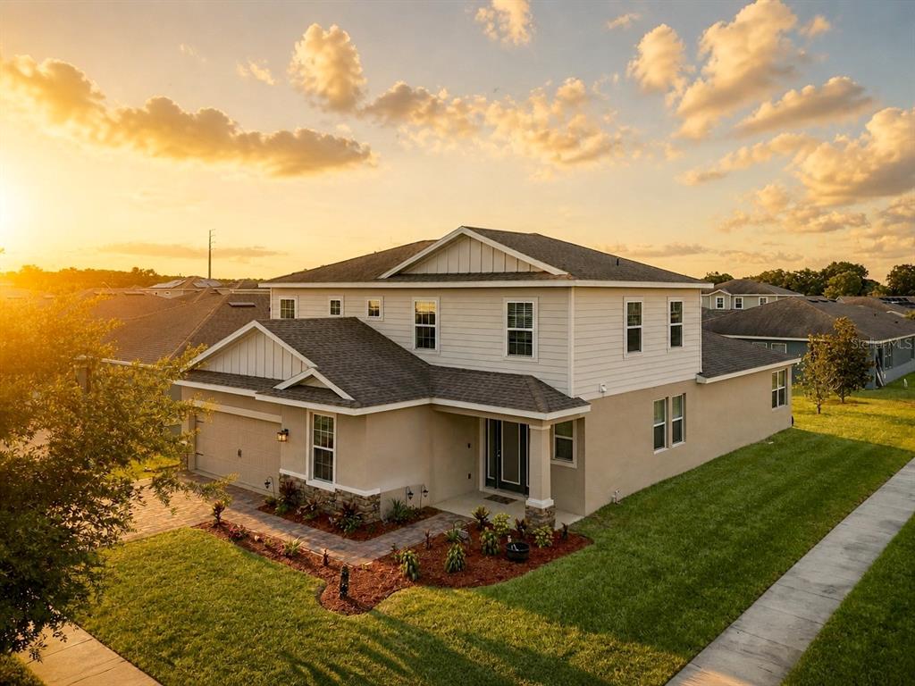 An aerial view shows two-story suburban houses with paved driveways and green lawns — 536 AFFIRMED WAY, DAVENPORT, FL