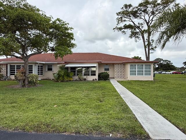 A single-story house with a red roof, white siding, and a concrete walkway — 4755 NW 3rd Court # C, Delray Beach FL 33445, DELRAY BEACH, FL