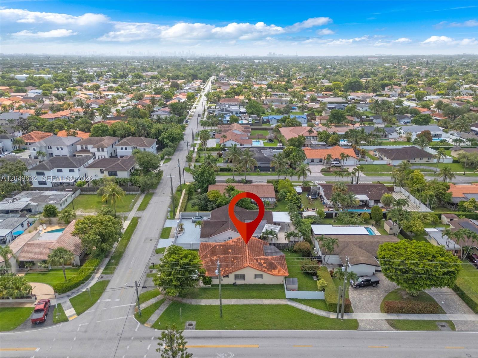 An aerial view shows a single-story house with a red tile roof and a red pin — 10190 SW 28th St, Miami FL 33165, MIAMI, FL