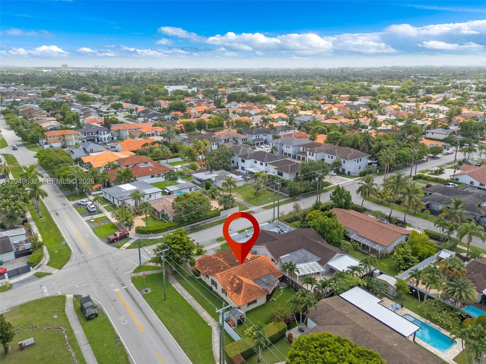 An aerial view shows a single-story house with a red tile roof and a pool — 10190 SW 28th St, Miami FL 33165, MIAMI, FL