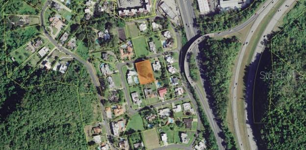 An aerial map view shows a highlighted vacant residential lot within a suburban neighborhood — B CONSTITUCION ST. EL RETIRO DEVELOPMENT LOT A-3, CAGUAS, PR