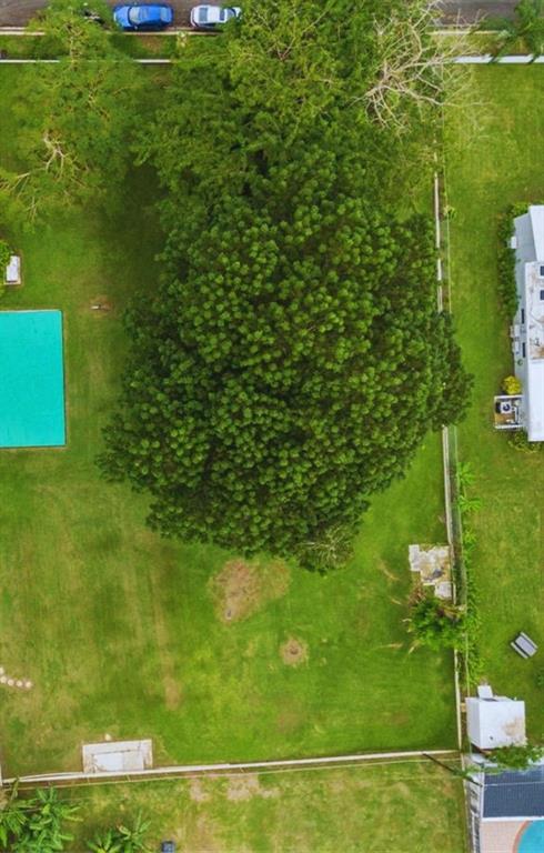 An aerial view shows a large backyard with a swimming pool and a prominent tree — B CONSTITUCION ST. EL RETIRO DEVELOPMENT LOT A-3, CAGUAS, PR