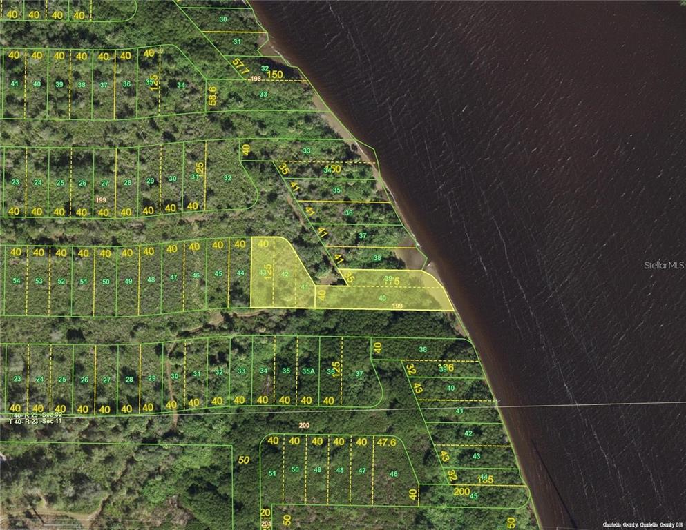 This is an aerial map showing several adjacent land parcels along a waterfront — 28137 SAN JOSE COURT, PUNTA GORDA, FL