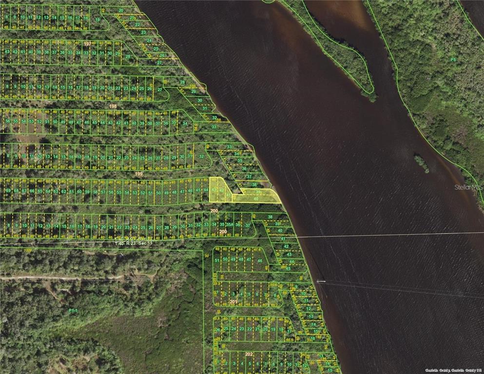 This is an aerial map showing subdivided land parcels along a riverbank — 28137 SAN JOSE COURT, PUNTA GORDA, FL