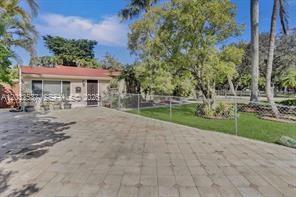 A single-story house with a red roof and a large paved driveway — 2199 NE 182nd St # 1, North Miami Beach FL 33162, NORTH MIAMI BEACH, FL