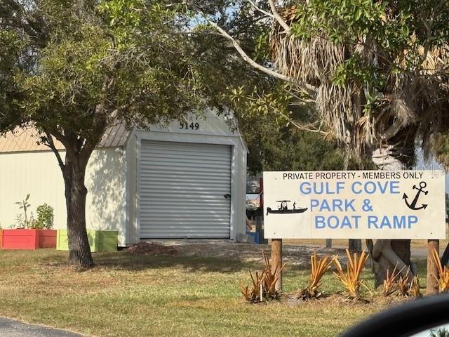 A white storage building stands behind a sign for Gulf Cove Park and Boat Ramp — JOSLYN TERRACE, PORT CHARLOTTE, FL