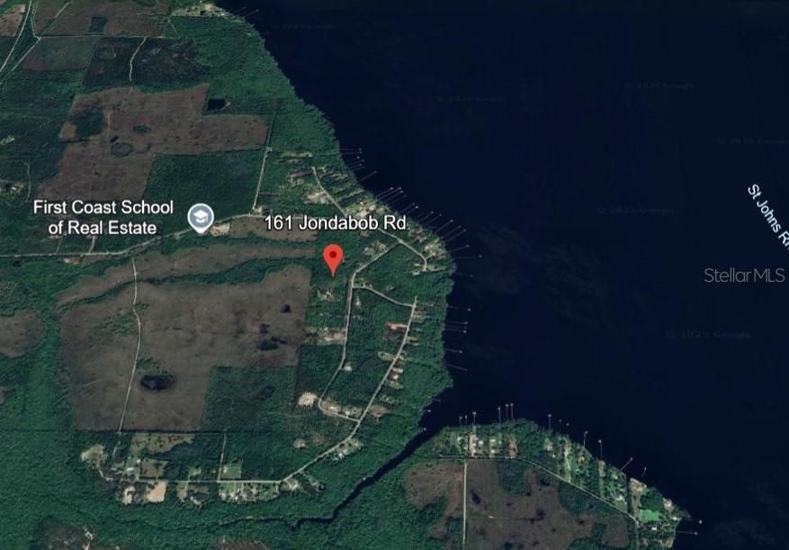This is an aerial map view showing a residential property located along a riverbank — 161 JONDABOB ROAD, GREEN COVE SPRINGS, FL