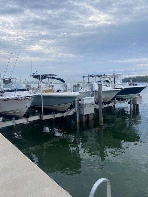 Several boats are docked at a marina under a cloudy sky — 150 SE 25th Rd Slip # 7, Miami FL 33129, MIAMI, FL
