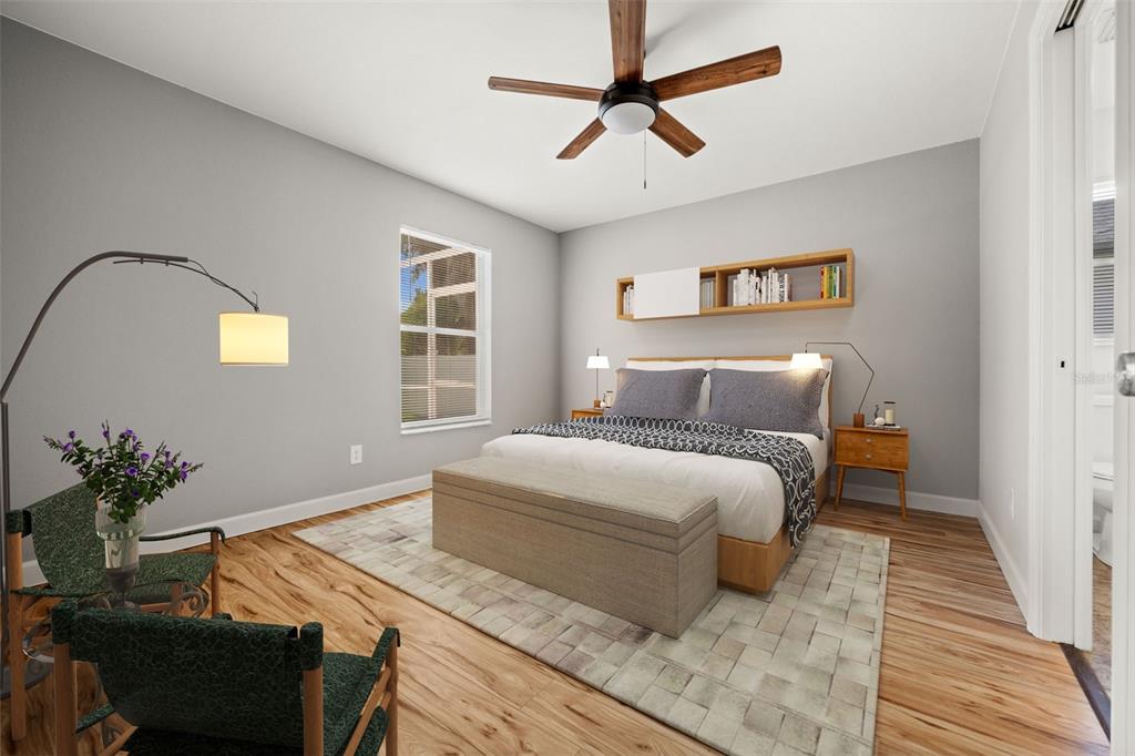 This is a digital rendering of a bedroom with gray walls, wood floors, and furniture — 2217 PICKARD LANE, NORTH PORT, FL