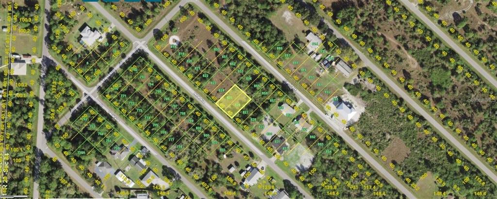 This is an aerial map showing a highlighted vacant lot within a residential neighborhood — 11420 9TH AVENUE, PUNTA GORDA, FL