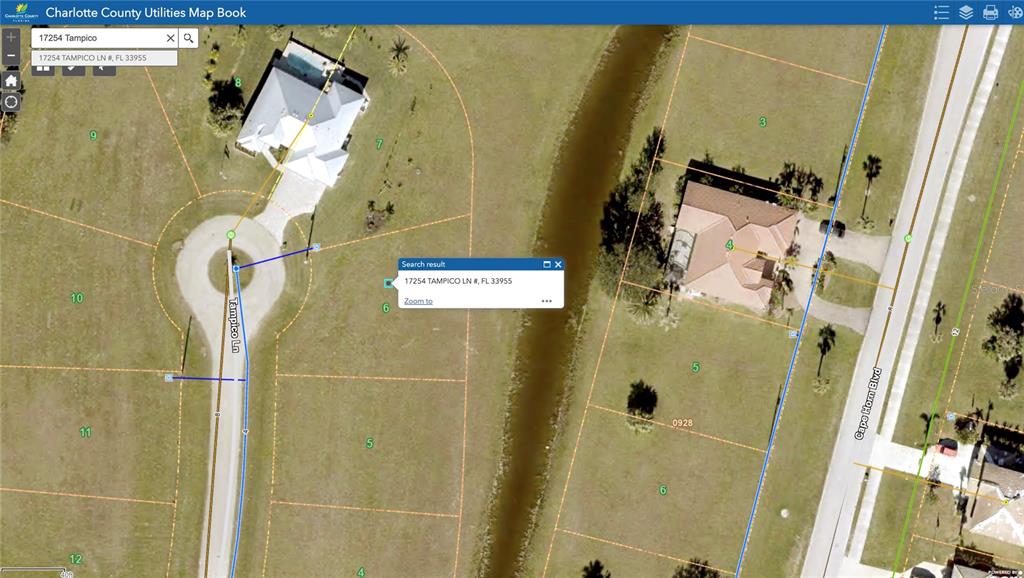 This is a satellite map showing residential lots, a canal, and street layouts — 17254 TAMPICO LANE, PUNTA GORDA, FL