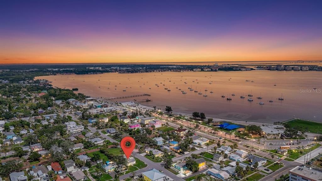 An aerial view shows a coastal neighborhood with a red location pin over a house — 3050 DUPONT STREET S, GULFPORT, FL