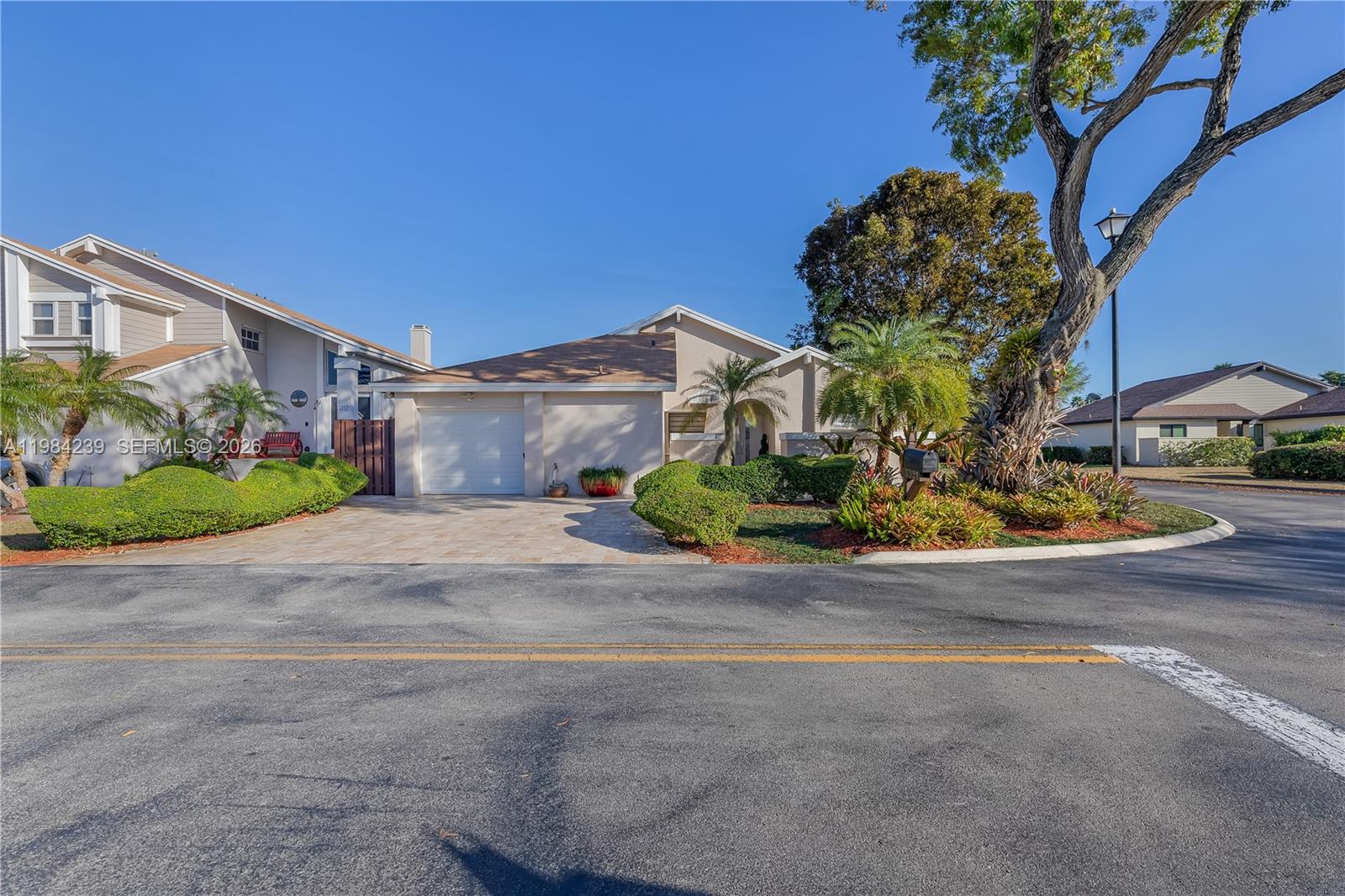 A single-story house with a garage and landscaped front yard sits along a paved street — 5321 SW 153rd Pl S, Miami FL 33185, MIAMI, FL