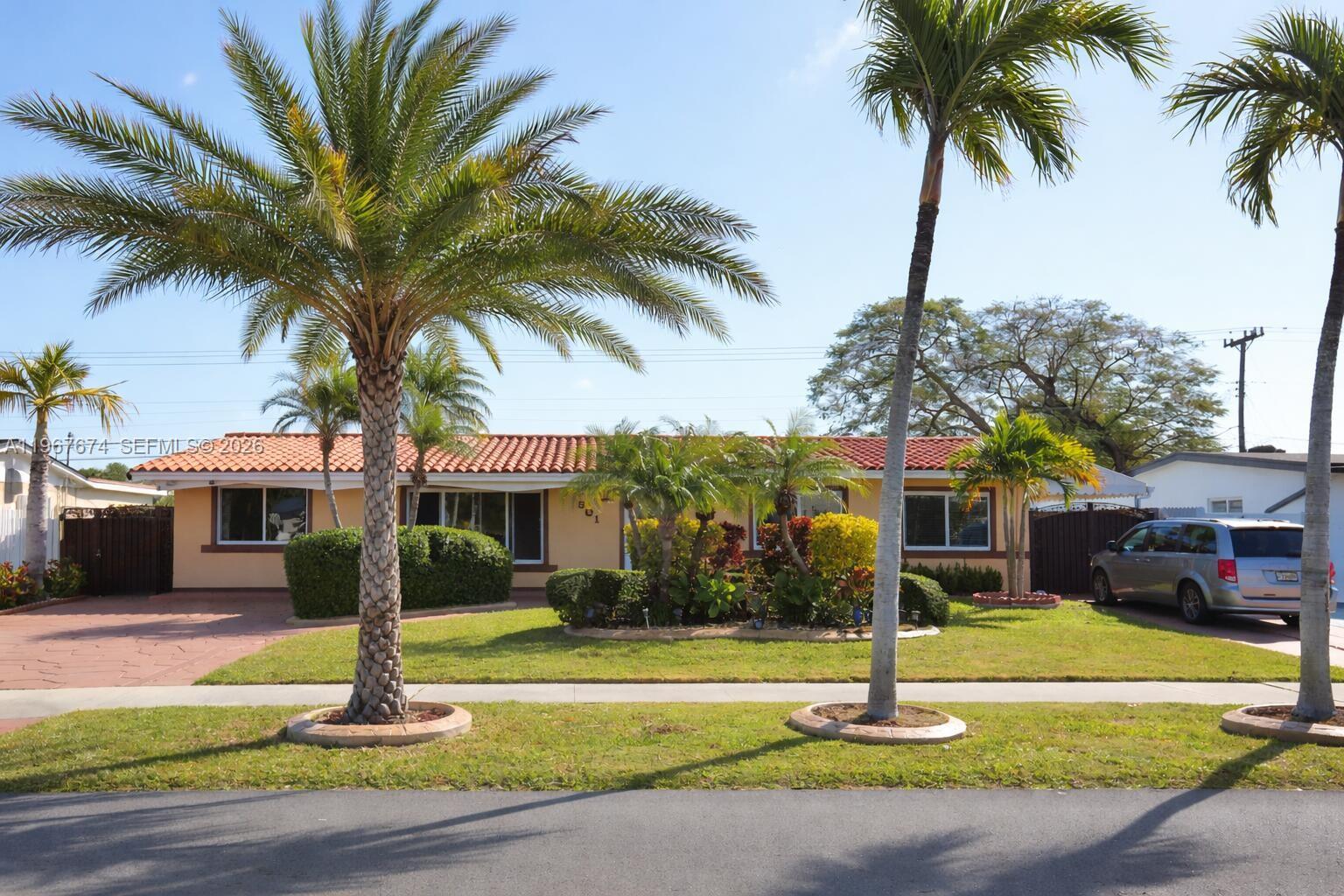 A single-story house with a red tile roof and palm trees in the front yard — 1901 SW 90th Ave, Miami FL 33165, MIAMI, FL