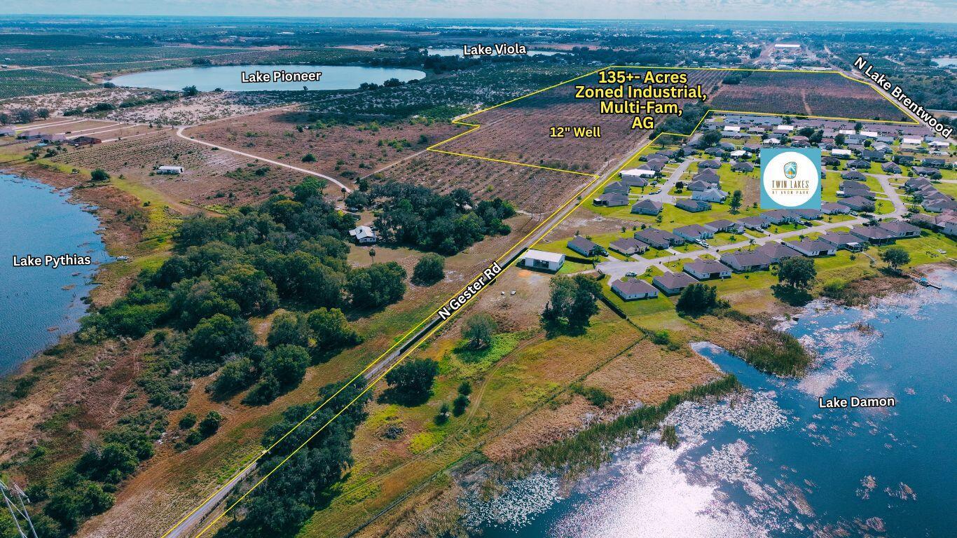 An aerial view shows a large plot of land outlined in yellow near several lakes — 214 E Shockley Road, FL 33825, FL