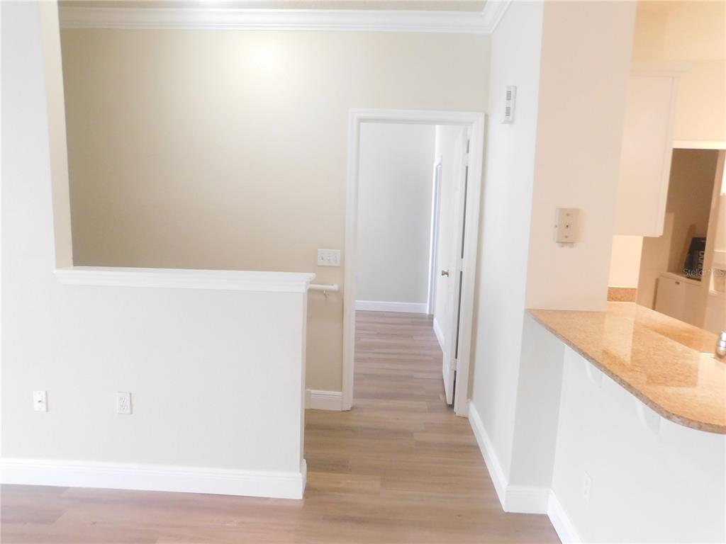 An interior view shows a half-wall, a doorway leading to another room, and a countertop — 417 SOUTHERN PECAN CIRCLE UNIT 201, WINTER GARDEN, FL