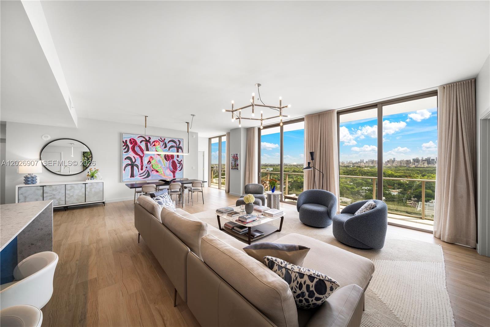 A modern living and dining area features light wood floors, floor-to-ceiling windows, and city views — 2678 Tigertail Ave # 1702, Miami FL 33133, MIAMI, FL