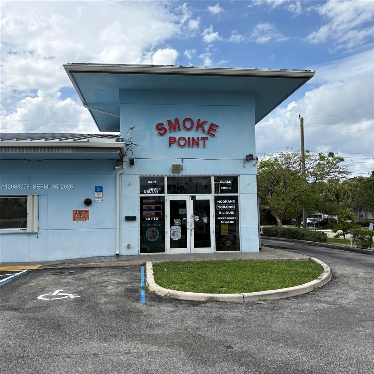 A light blue commercial building with a flat roof and a glass storefront entrance — 5901 Johnson St, Hollywood FL 33021, HOLLYWOOD, FL