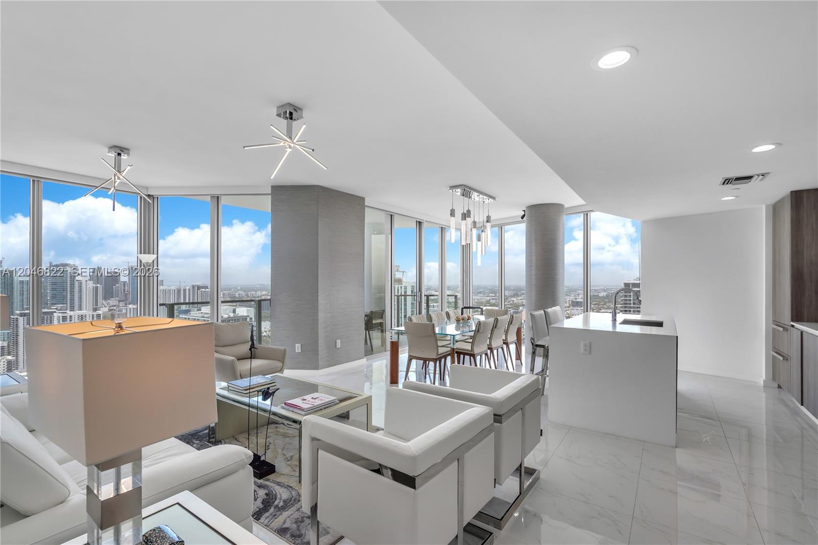 An aerial view shows a tall residential skyscraper surrounded by water and other high-rise buildings — 2900 NE 7th Ave # 4308, Miami FL 33137, MIAMI, FL