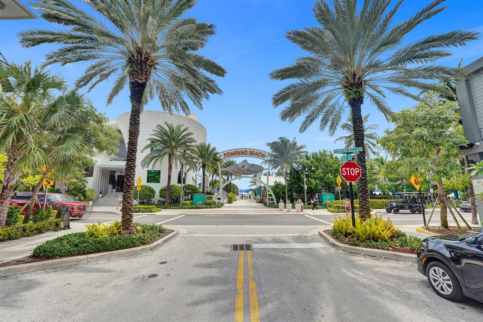 A street view shows a Pompano Beach entrance archway framed by palm trees and signage — 0 NW 15th Avenue, Pompano Beach FL 33069, POMPANO BEACH, FL
