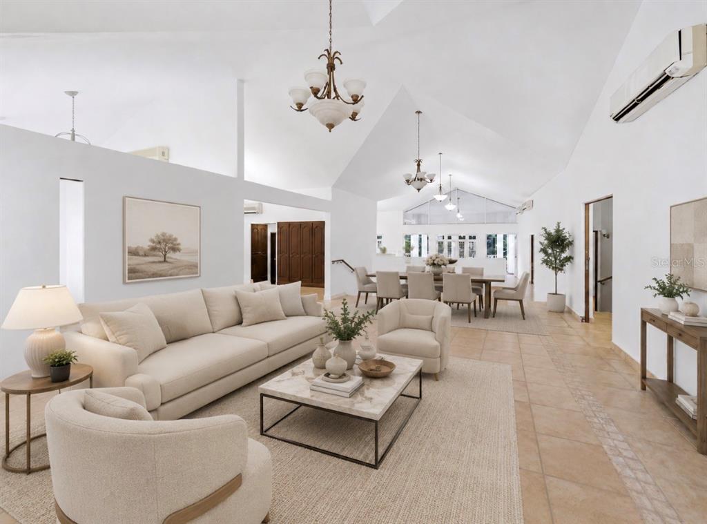A spacious living and dining area with vaulted ceilings, tile floors, and neutral furniture — 7 VANDA, GUAYNABO, PR