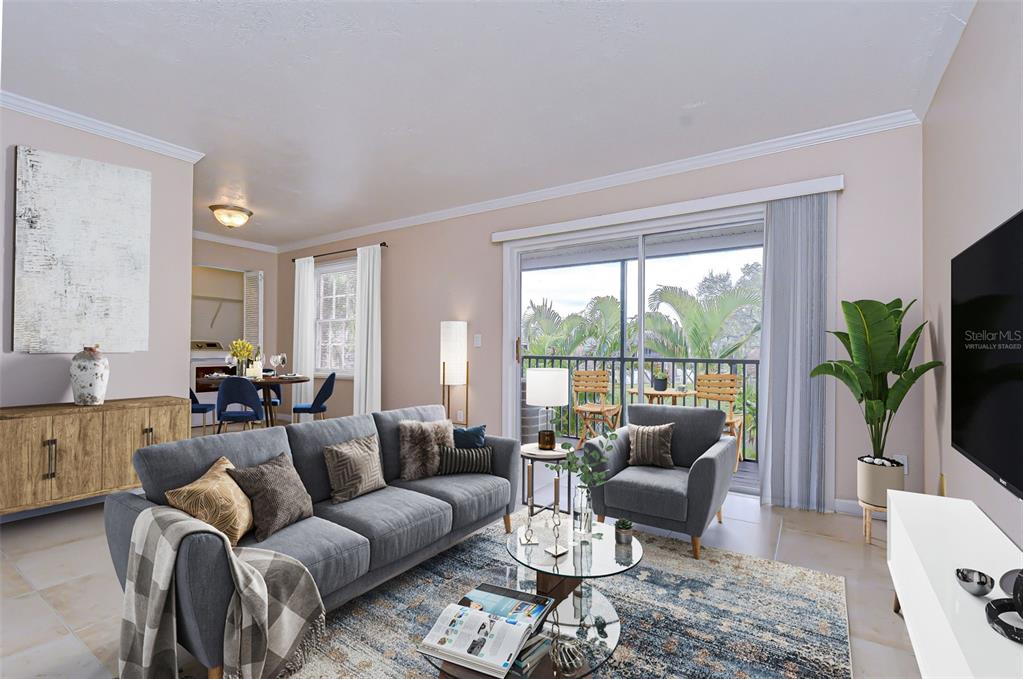 A living room features a gray sofa, armchair, glass coffee table, and a balcony view — 13693 ORANGE SUNSET DRIVE UNIT 203, TAMPA, FL