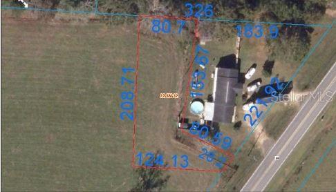 This is an aerial map showing a property boundary outline with dimensions over a residential lot — 3800 HIGHWAY 99, CENTURY, FL