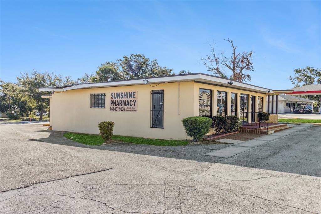 A beige, single-story commercial building with a flat roof and a parking lot — 1231 LAKELAND HILLS BOULEVARD, LAKELAND, FL