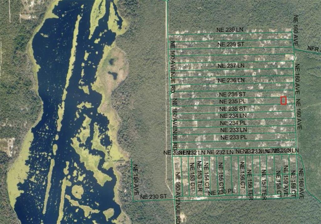 This is an aerial map showing a residential area with a highlighted property lot — Lot 21 NE STREET, FORT MC COY, FL